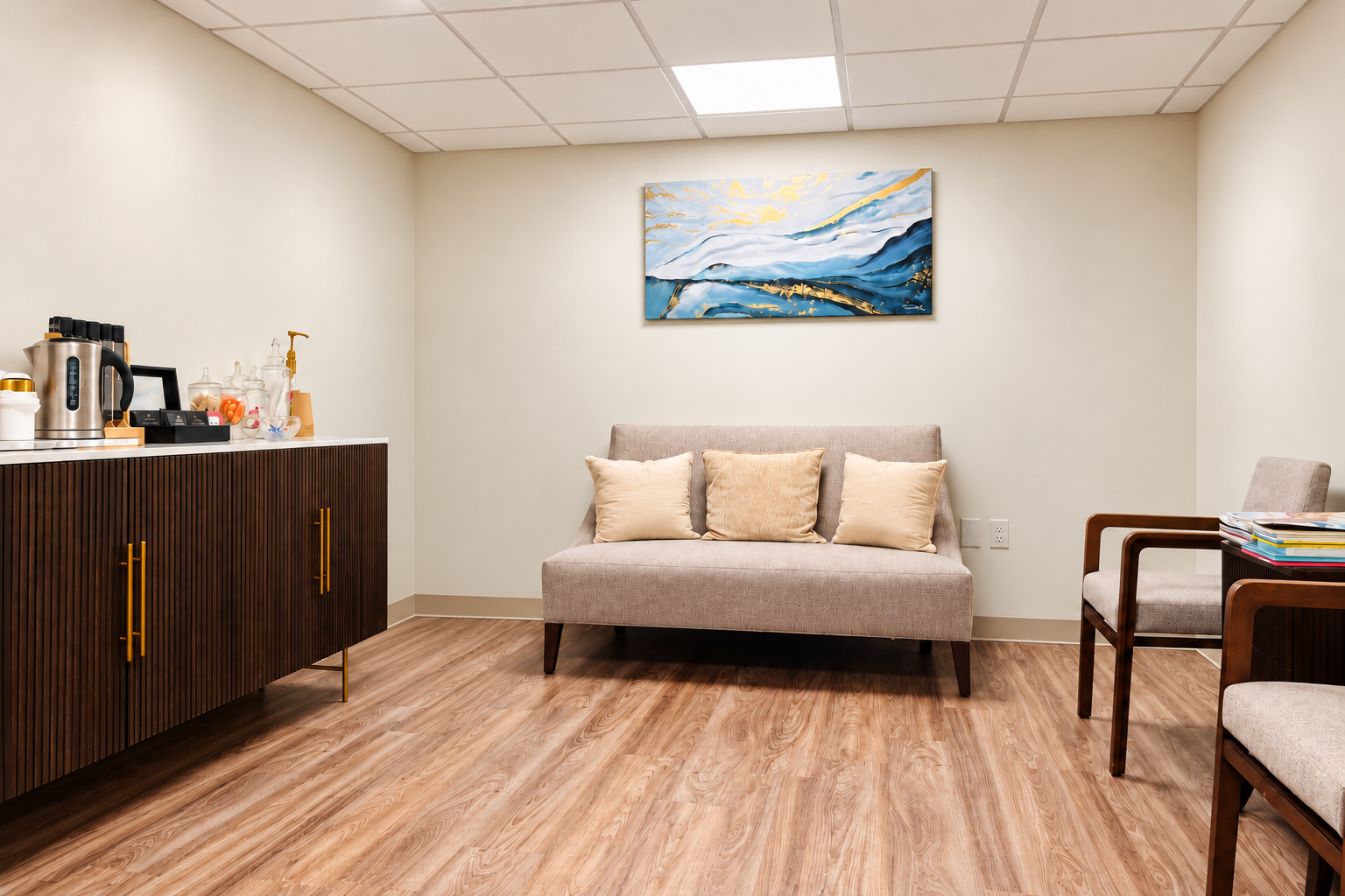 The Cedar patient lounge with seating and refreshment area — digitally enhanced office photograph